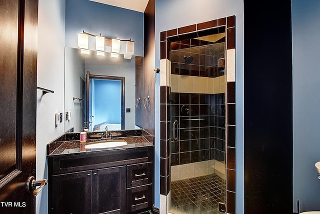 bathroom with vanity and an enclosed shower