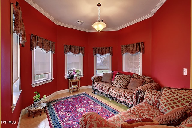 living room featuring ornamental molding and hardwood / wood-style floors