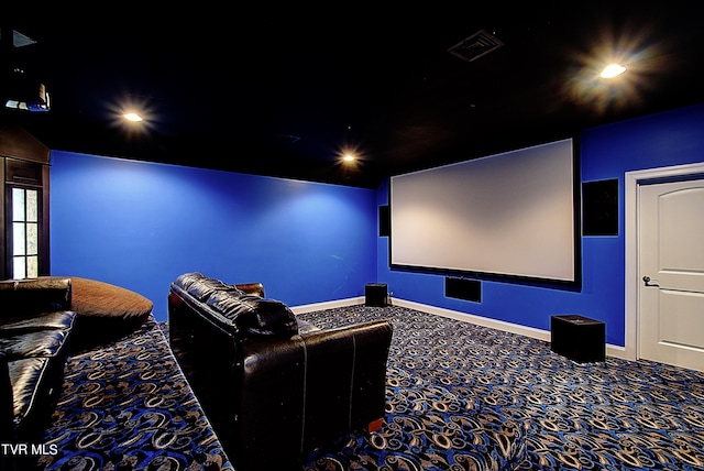 cinema room featuring carpet