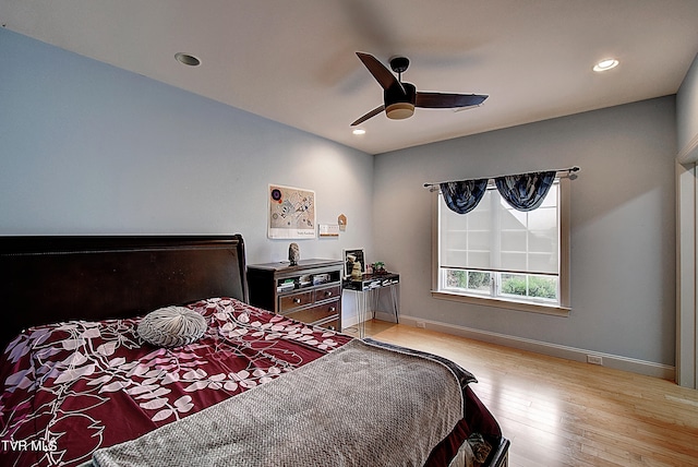 bedroom featuring ceiling fan and light hardwood / wood-style flooring