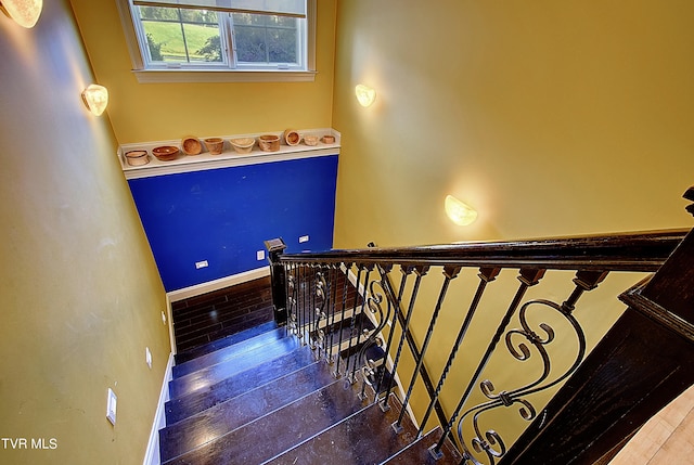 stairs with wood-type flooring