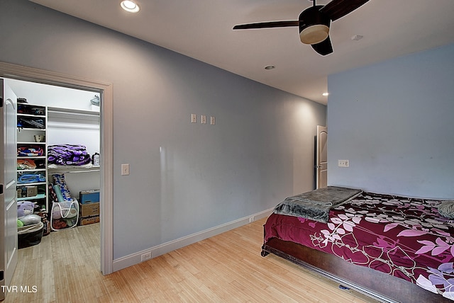 bedroom featuring wood-type flooring and ceiling fan