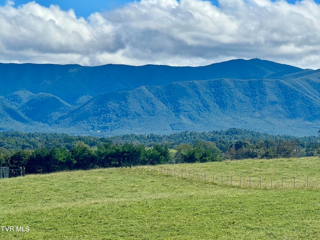 mountain view featuring a rural view