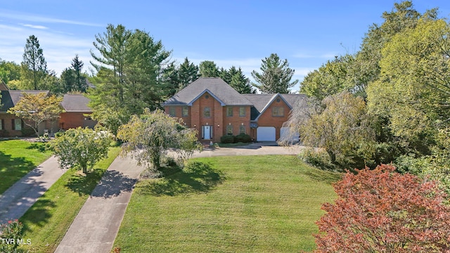 view of front of house with a front lawn and a garage