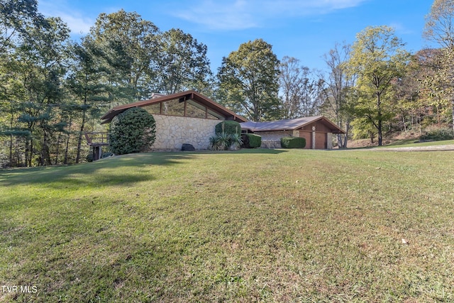 view of side of home featuring a yard