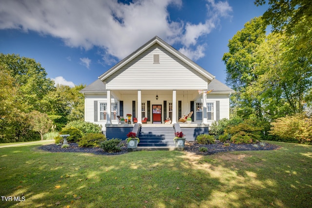 view of front of home with a front lawn and covered porch