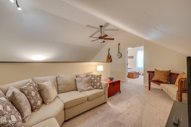 carpeted living room featuring vaulted ceiling and ceiling fan