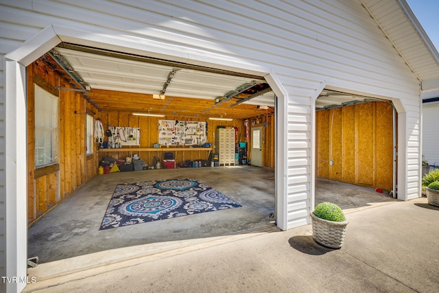 garage featuring wooden walls