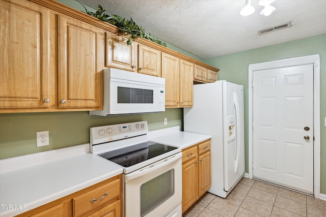 506 Pilgrim Ct Unit B, Johnson City, TN 37601 - kitchen with visible vents, light tile patterned flooring, white appliances, and a textured ceiling