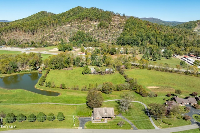 bird's eye view with a water and mountain view