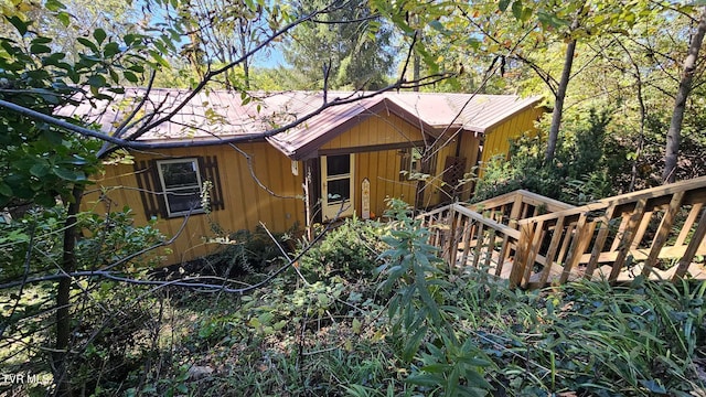 view of front of property with a wooden deck