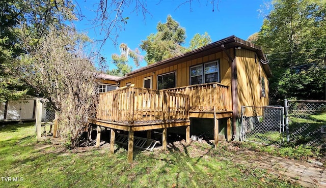 rear view of property with a wooden deck