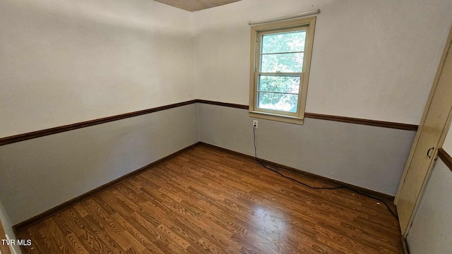 spare room with hardwood / wood-style flooring