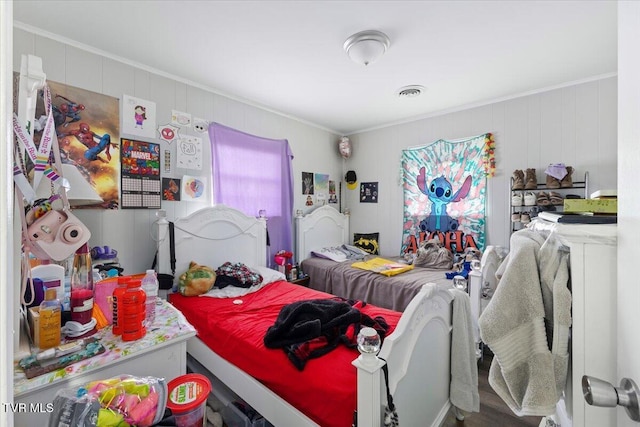 bedroom with ornamental molding