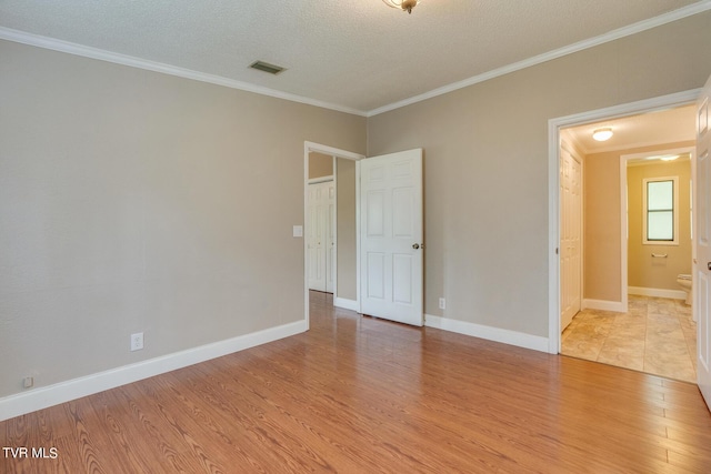 22088 Parks Mill Rd, Abingdon, VA 24211 - spare room with light wood-style flooring, crown molding, a textured ceiling, and baseboards