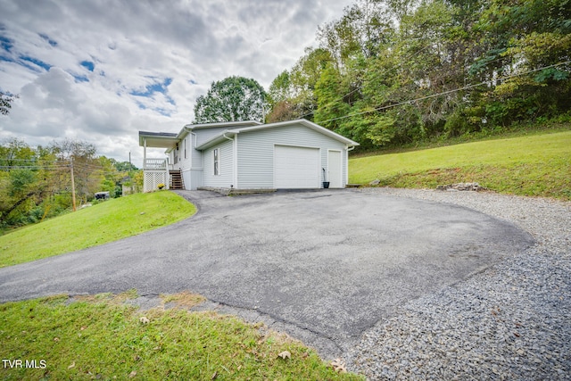 exterior space with a front lawn and a garage