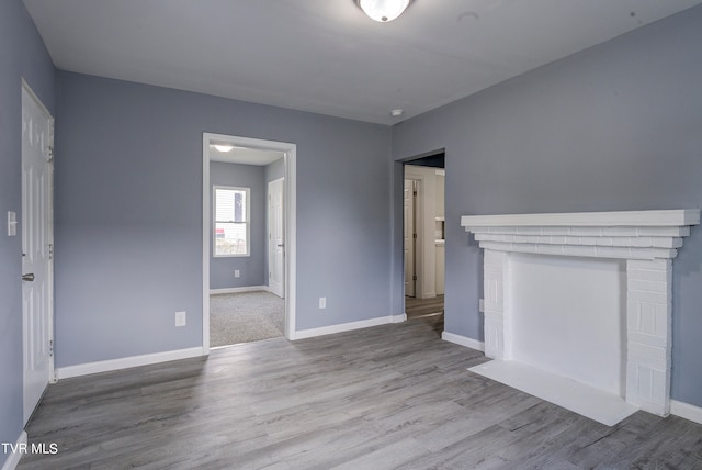 unfurnished living room featuring light hardwood / wood-style floors