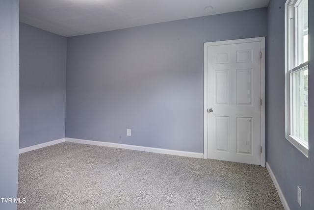 unfurnished room with carpet