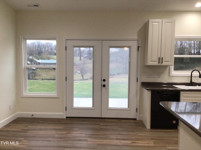 entryway with french doors, dark wood-type flooring, and sink