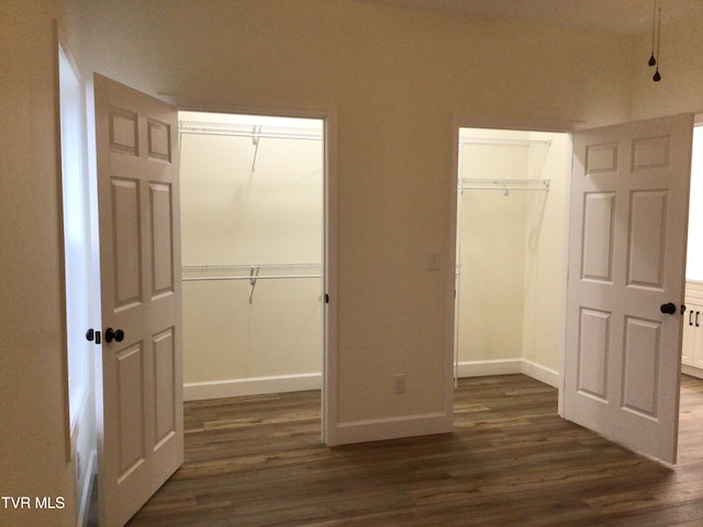 unfurnished bedroom with radiator, a closet, and dark hardwood / wood-style floors