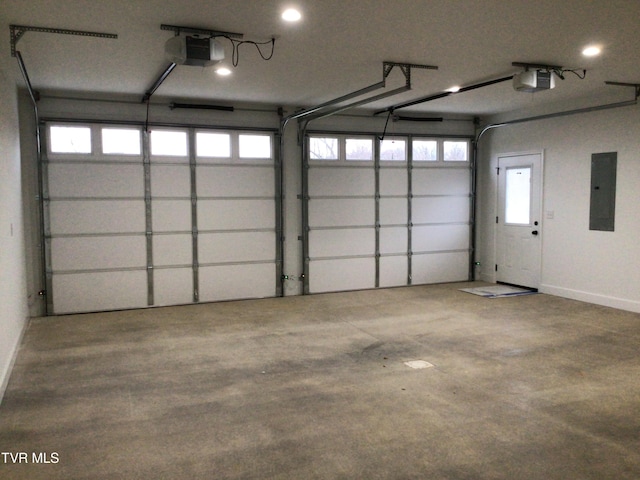 garage with electric panel and a garage door opener