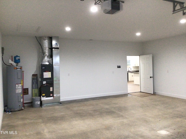 garage featuring heating unit, a garage door opener, and water heater