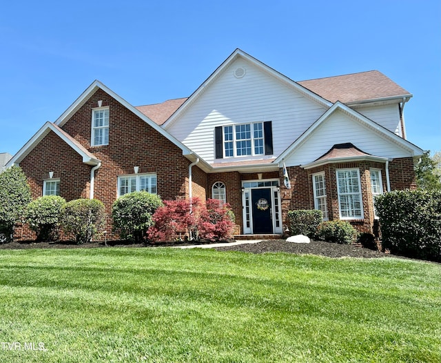 front facade featuring a front lawn