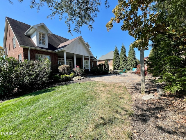 exterior space featuring a yard and a patio