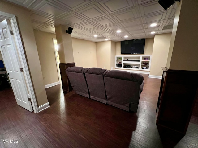 living room featuring built in features and dark hardwood / wood-style flooring