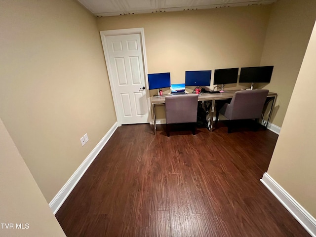 office space with dark hardwood / wood-style flooring