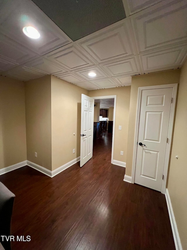 unfurnished room featuring dark hardwood / wood-style flooring