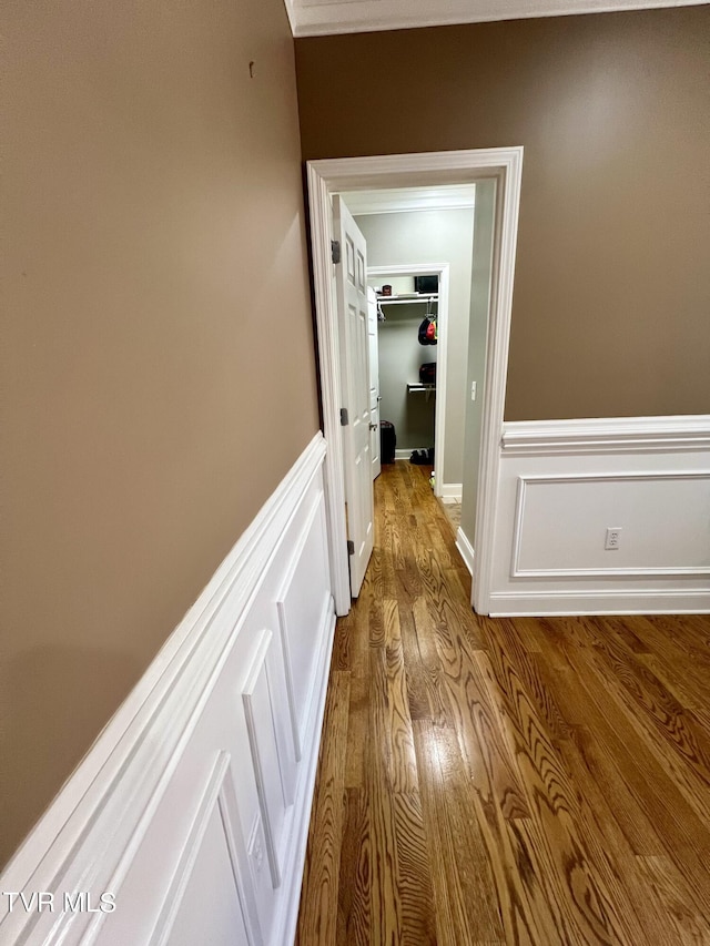 corridor featuring crown molding and wood-type flooring