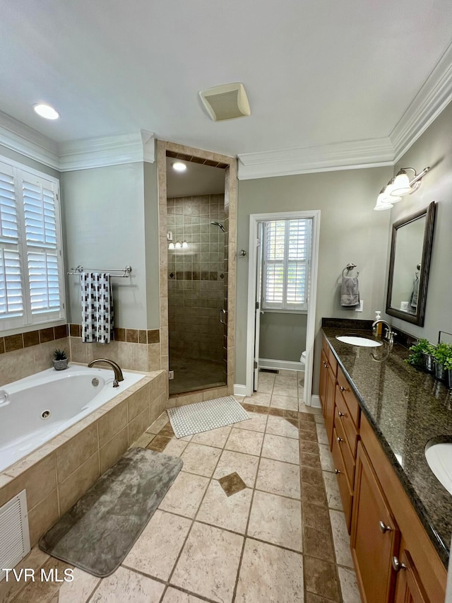 full bathroom with vanity, toilet, ornamental molding, and shower with separate bathtub