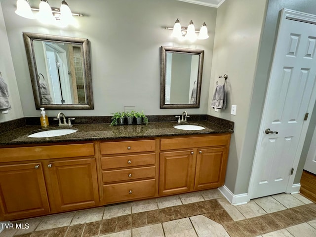 bathroom featuring vanity and crown molding