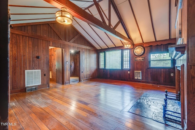 120 Rock Rd, Bristol, TN 37620 - unfurnished living room with hardwood / wood-style flooring and wood walls