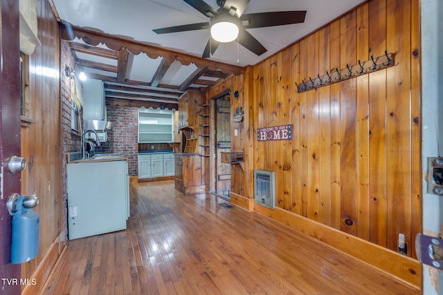 120 Rock Rd, Bristol, TN 37620 - kitchen featuring wooden walls, wood-type flooring, ceiling fan, heating unit, and beamed ceiling