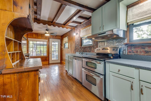 120 Rock Rd, Bristol, TN 37620 - kitchen with under cabinet range hood, stainless steel appliances, a sink, healthy amount of natural light, and beam ceiling
