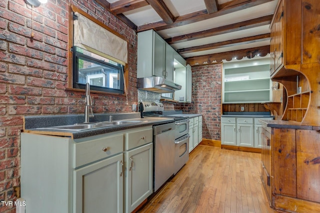 120 Rock Rd, Bristol, TN 37620 - kitchen with a sink, brick wall, under cabinet range hood, dark countertops, and appliances with stainless steel finishes