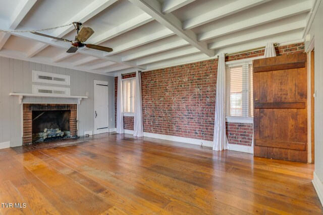 120 Rock Rd, Bristol, TN 37620 - unfurnished living room featuring hardwood / wood-style flooring, ceiling fan, beam ceiling, baseboards, and a brick fireplace