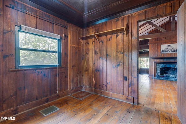 120 Rock Rd, Bristol, TN 37620 - unfurnished room featuring wooden walls, wood-type flooring, and a fireplace
