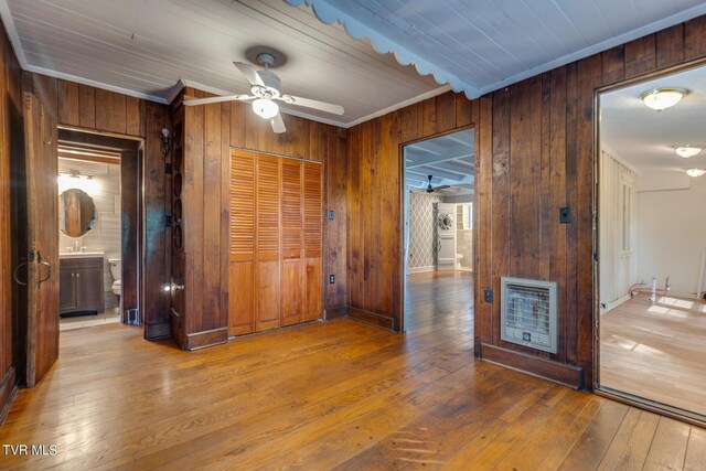 120 Rock Rd, Bristol, TN 37620 - unfurnished room with wood walls, hardwood / wood-style floors, ceiling fan, and heating unit