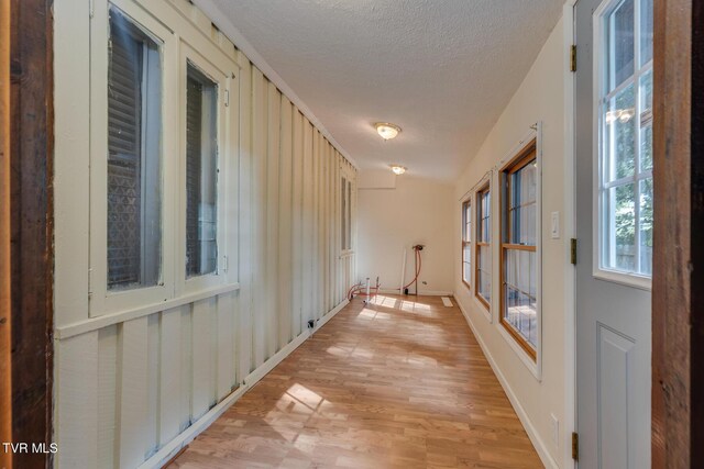 120 Rock Rd, Bristol, TN 37620 - hall featuring a textured ceiling, light wood-style floors, and baseboards