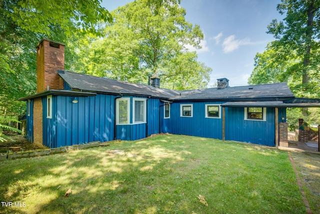 120 Rock Rd, Bristol, TN 37620 - rear view of property with a chimney, board and batten siding, and a lawn
