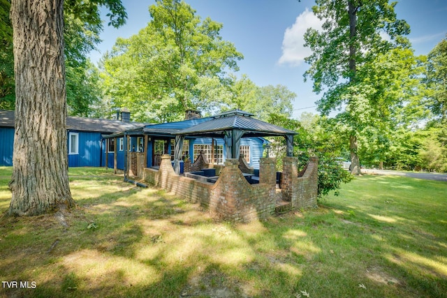 120 Rock Rd, Bristol, TN 37620 - rear view of property with a yard, a gazebo, and a chimney