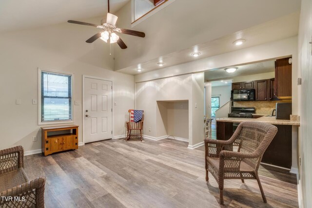 120 Rock Rd, Bristol, TN 37620 - living area featuring a ceiling fan, light wood-style floors, baseboards, and high vaulted ceiling