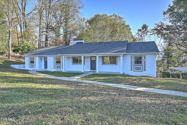 single story home with a front yard