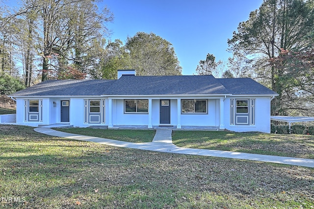 single story home featuring a front lawn