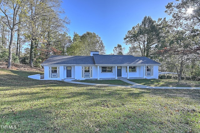 ranch-style home with a front lawn