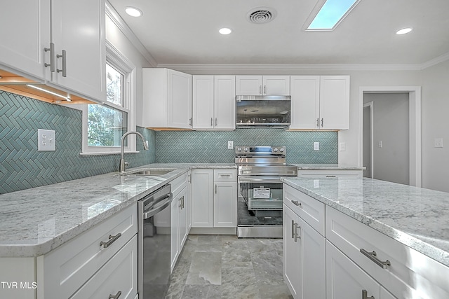 kitchen featuring tasteful backsplash, crown molding, sink, stainless steel appliances, and white cabinetry