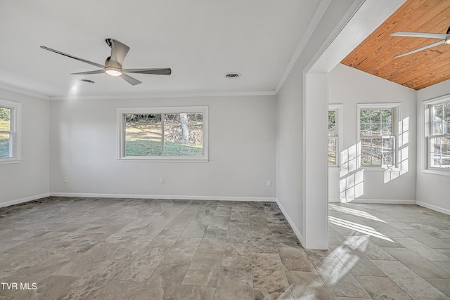 unfurnished room with ornamental molding, lofted ceiling, and a wealth of natural light